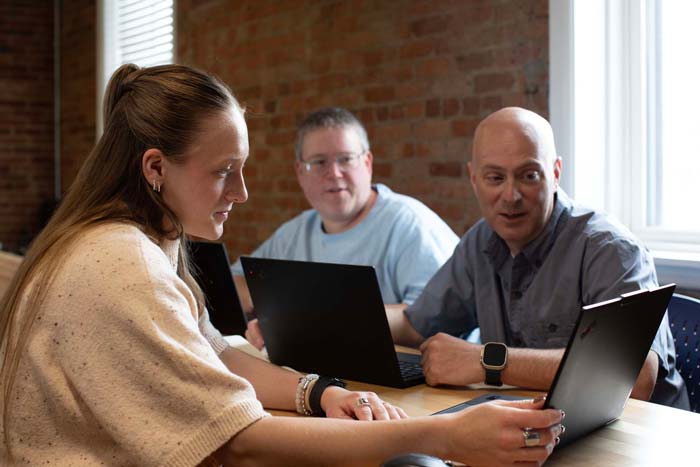 Clipcentric team group working in office